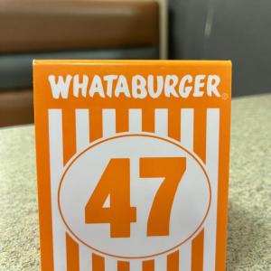 Whataburger table number 47 on a restaurant table.